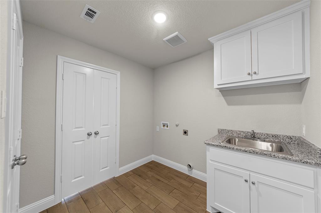 18310 Chippewa Court Terrell, TX 75160 - Photo 19 of 35 a bathroom with a sink and cabinets