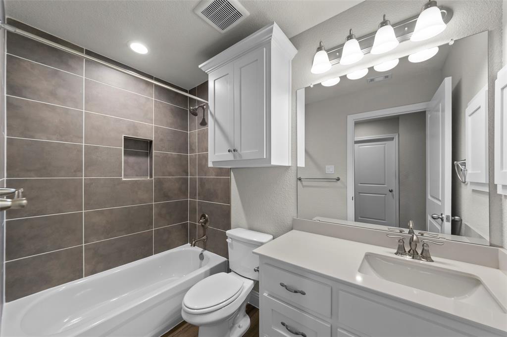 18310 Chippewa Court Terrell, TX 75160 - Photo 20 of 35 a bathroom with a sink a toilet and shower