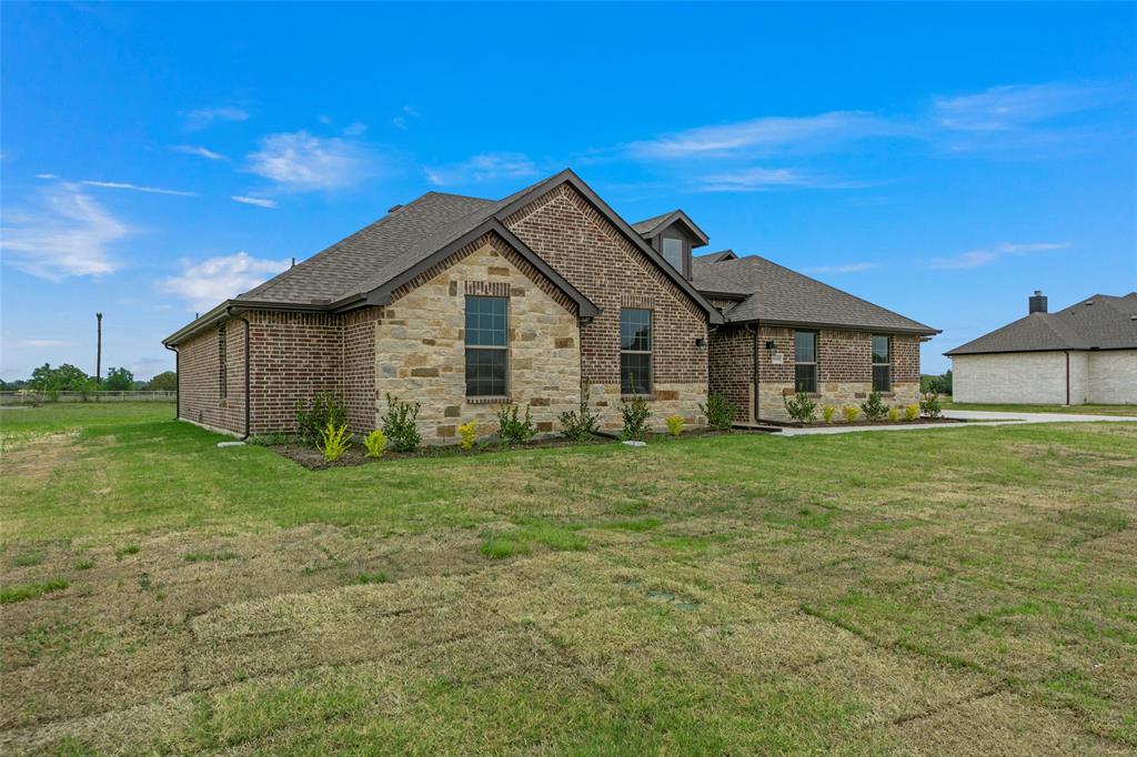 18310 Chippewa Court Terrell, TX 75160 - Photo 2 of 35 a view of a house with a yard