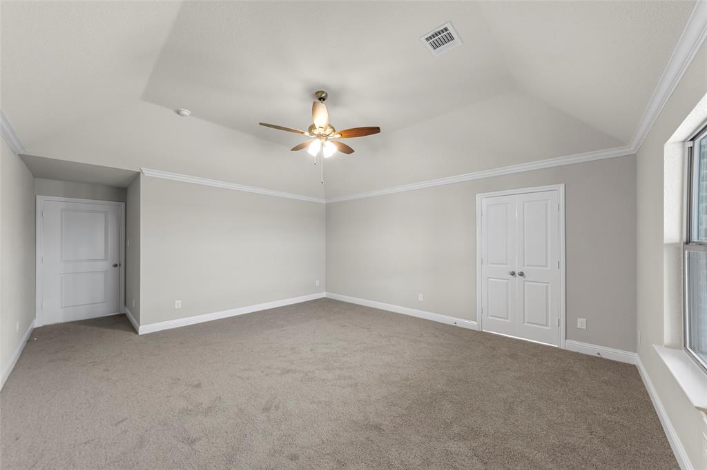 18310 Chippewa Court Terrell, TX 75160 - Photo 23 of 35 an empty room with a ceiling fan and a window