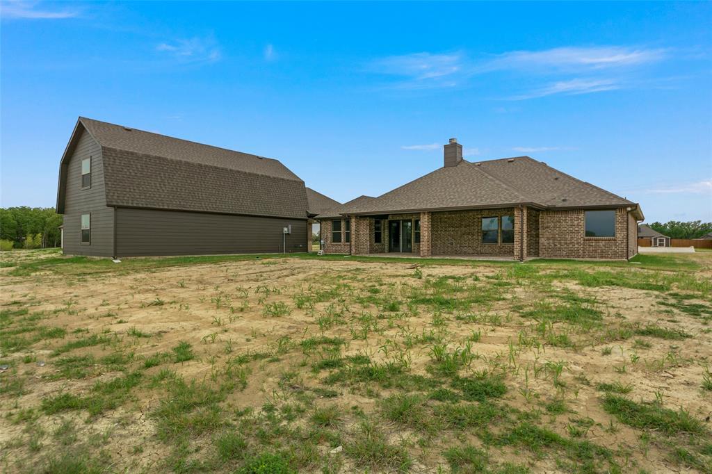 18310 Chippewa Court Terrell, TX 75160 - Photo 29 of 35 a house with green field in front of it