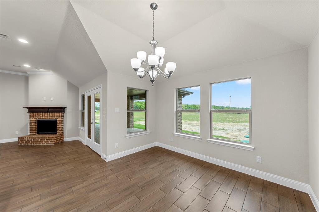 18310 Chippewa Court Terrell, TX 75160 - Photo 8 of 35 a view of an empty room with a window and fireplace