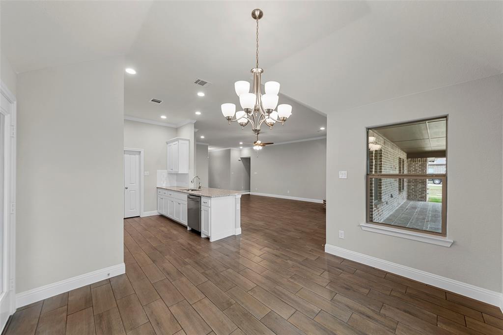 18310 Chippewa Court Terrell, TX 75160 - Photo 10 of 35 a view of a room with chandelier and wooden floor