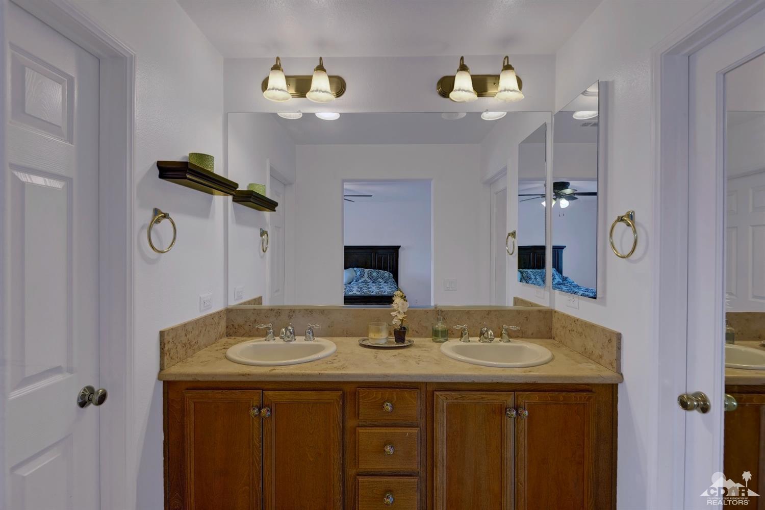 37773 Caprice Drive Indio, CA 92203 - Photo 17 of 26 a bathroom with a sink and a mirror