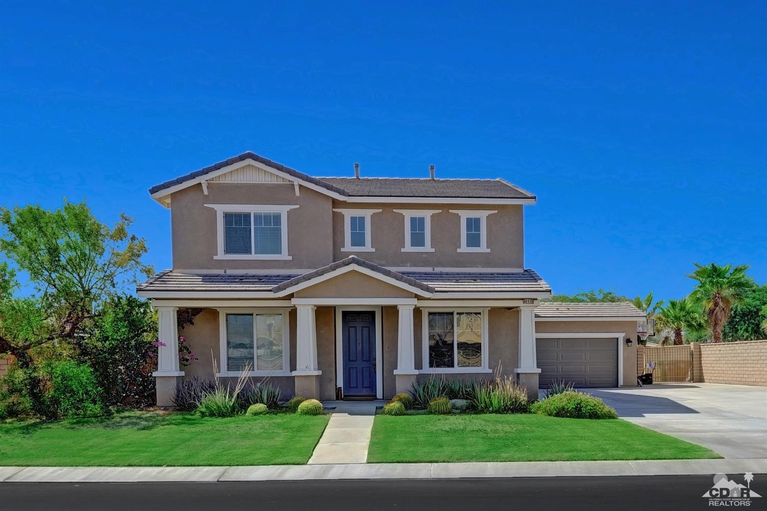 37773 Caprice Drive Indio, CA 92203 - Photo 5 of 26 a front view of a house with a yard