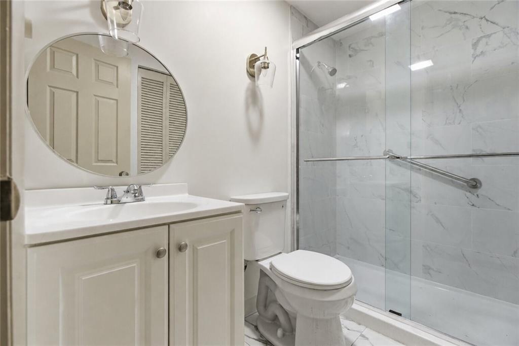 750 Washington Road, Unit 307 Pittsburgh, PA 15228 - Photo 11 of 24 a bathroom with a sink a toilet and shower