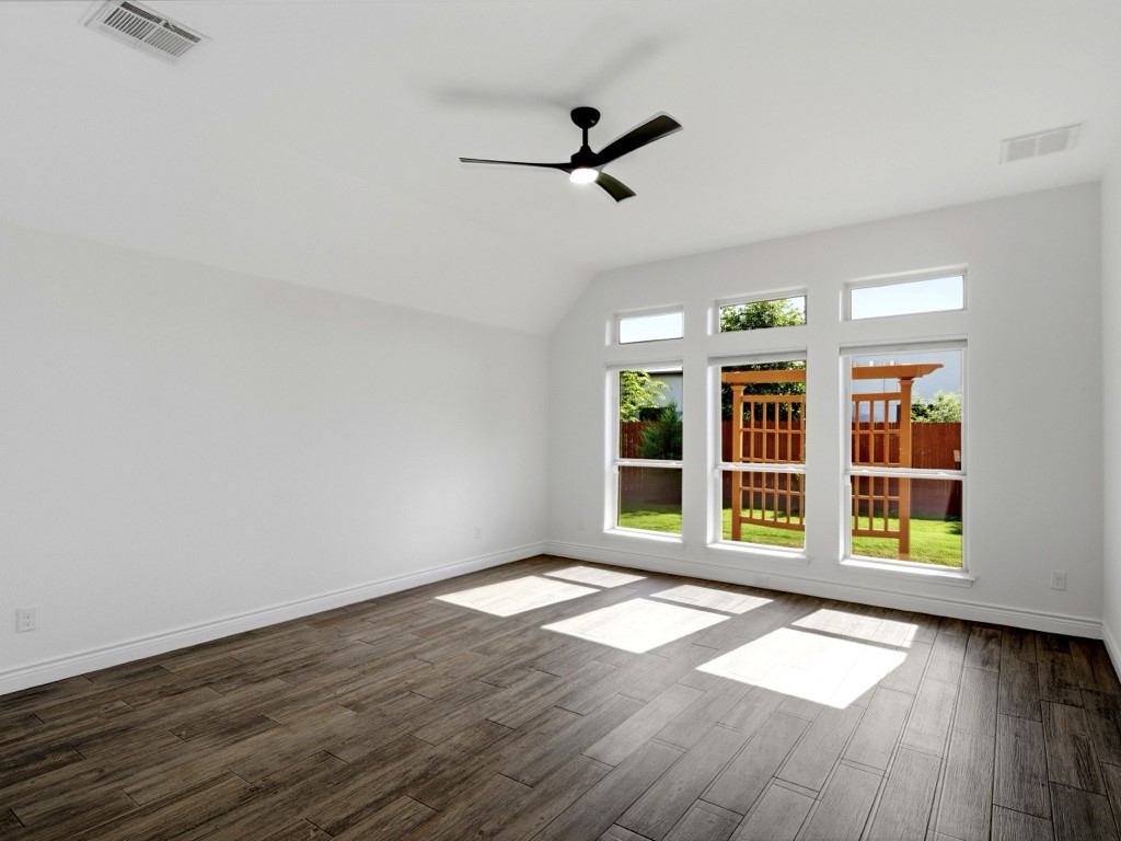 109 Lake Spring Circle Georgetown, TX 78633 - Photo 28 of 38 Sun-filled second bedroom boasts high ceilings.