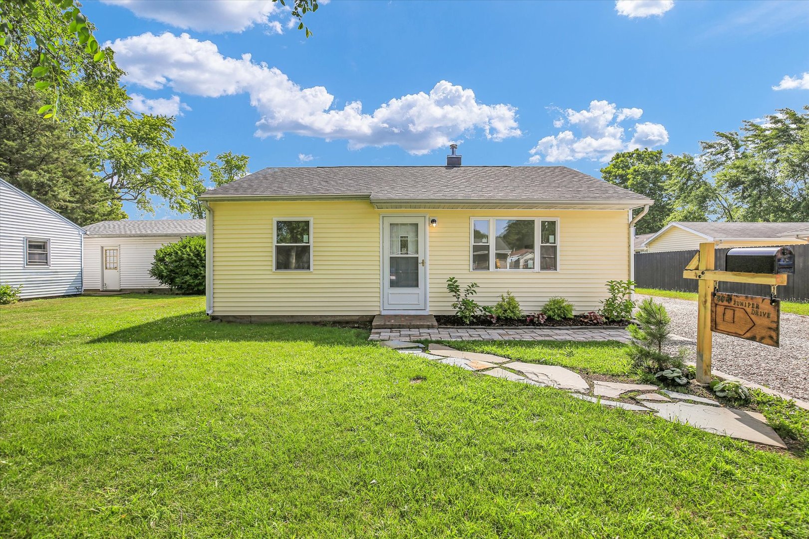 a house view with a garden space