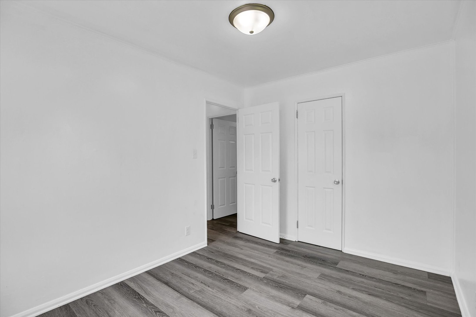 804 Juniper Drive Rantoul, IL 61866 - Photo 17 of 24 a view of an empty room and wooden floor