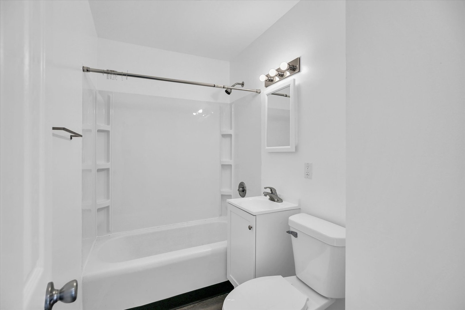 804 Juniper Drive Rantoul, IL 61866 - Photo 18 of 24 a bathroom with a toilet a sink and a bathtub