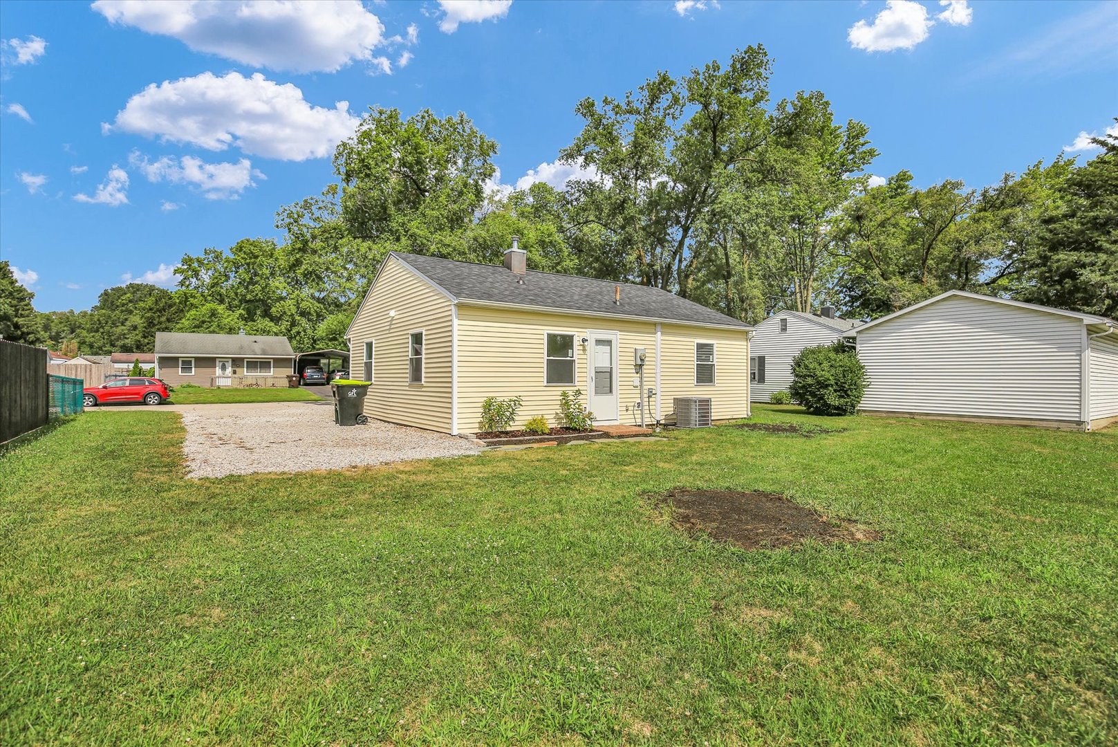 804 Juniper Drive Rantoul, IL 61866 - Photo 23 of 24 a view of a house with backyard and garden