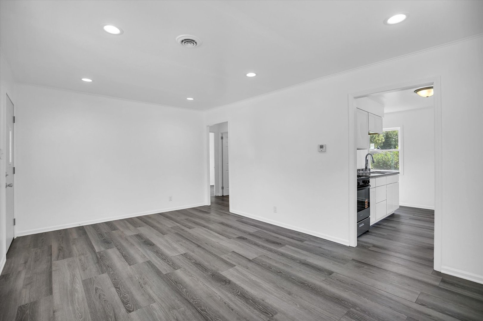 804 Juniper Drive Rantoul, IL 61866 - Photo 8 of 24 a view of empty room with wooden floor