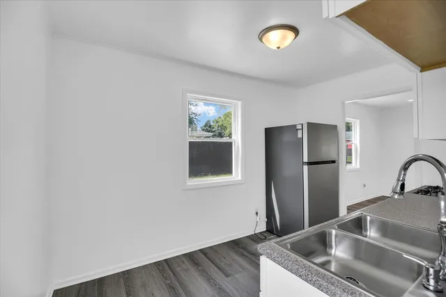 a kitchen with a stove and a microwave