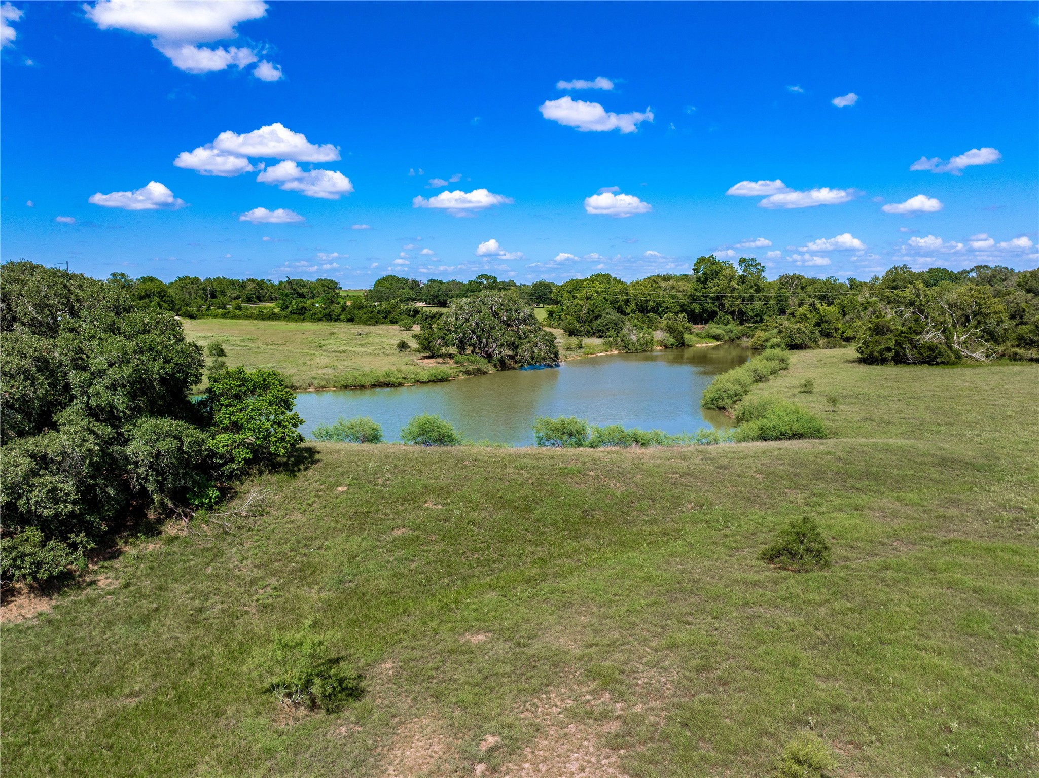 253 Cr 253 Road Weimar, TX 78962 - Photo 19 of 27 a view of a lake in middle of the house