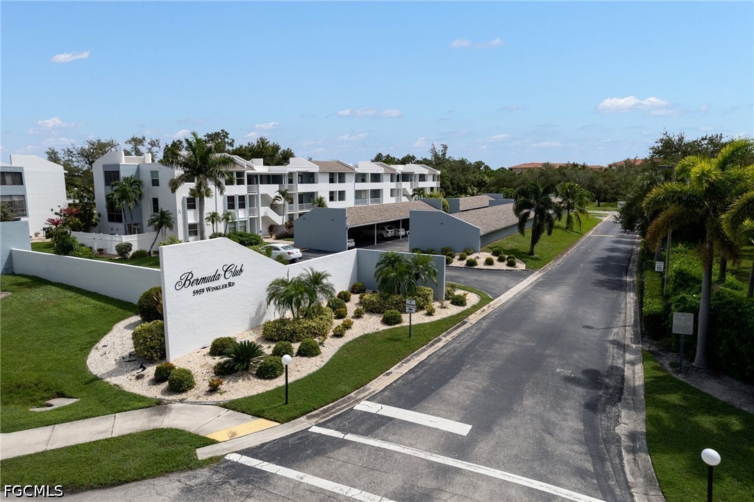 5959 Winkler Road, Unit 103 Fort Myers, FL 33919 - Photo 1 of 24 a view of a swimming pool and outdoor seating