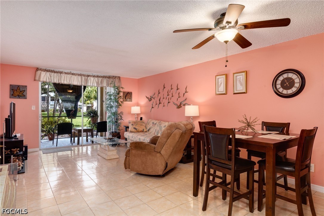 5959 Winkler Road, Unit 103 Fort Myers, FL 33919 - Photo 14 of 24 a view of a livingroom with furniture and a fan