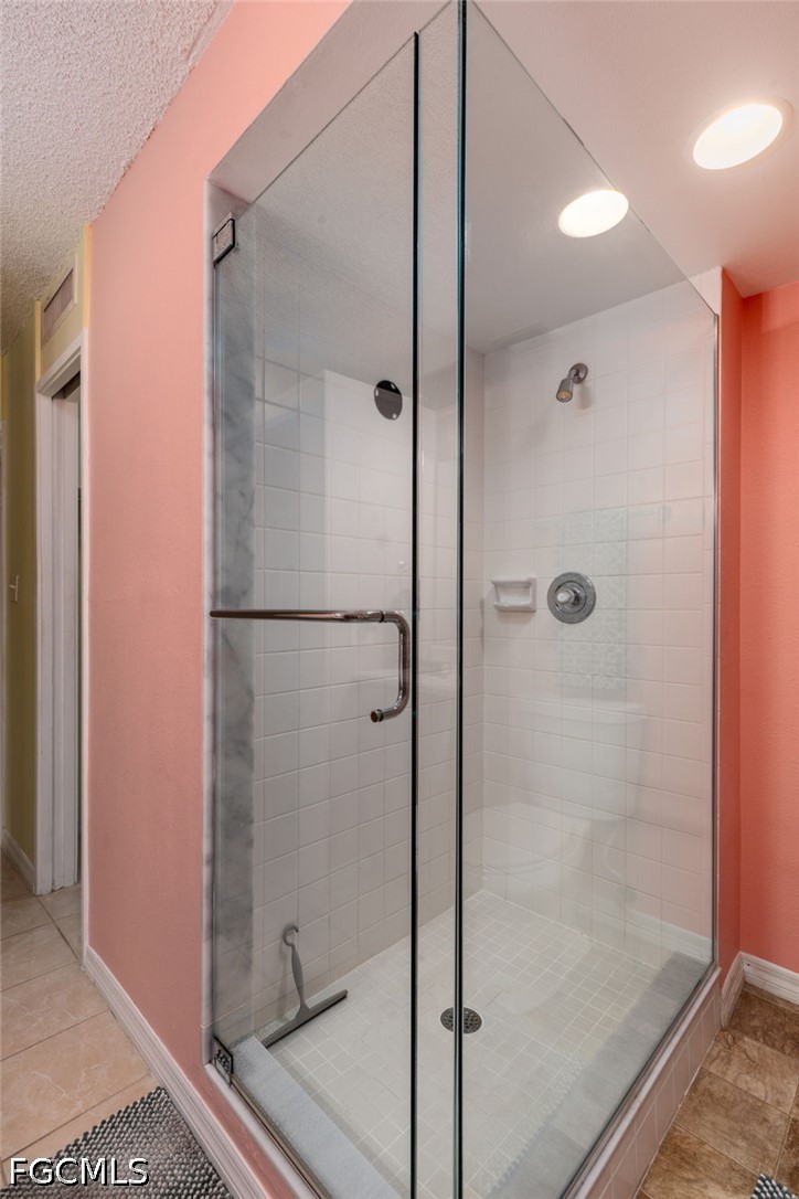 5959 Winkler Road, Unit 103 Fort Myers, FL 33919 - Photo 15 of 24 a bathroom with a glass shower door