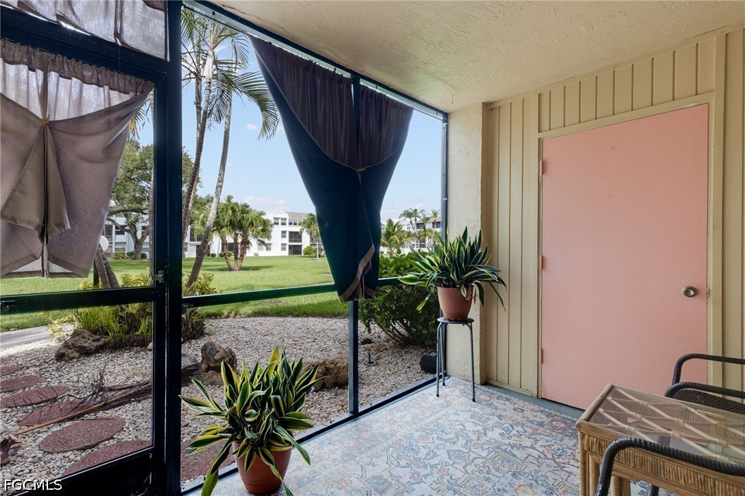 5959 Winkler Road, Unit 103 Fort Myers, FL 33919 - Photo 5 of 24 a view of a porch with furniture