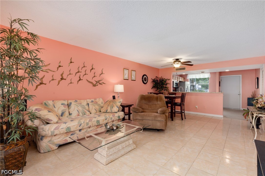 5959 Winkler Road, Unit 103 Fort Myers, FL 33919 - Photo 10 of 24 a living room with furniture and a couch