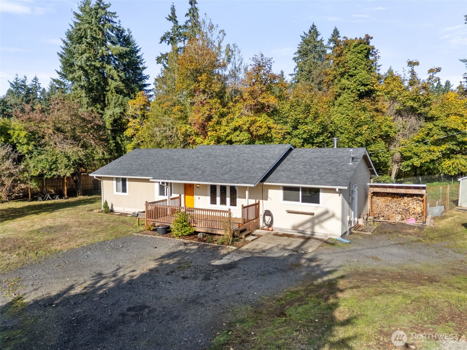 1003 Northwest Dexter Avenue Winlock, WA 98596 - Photo 2 of 39 a view of a house with a tree next to a big yard