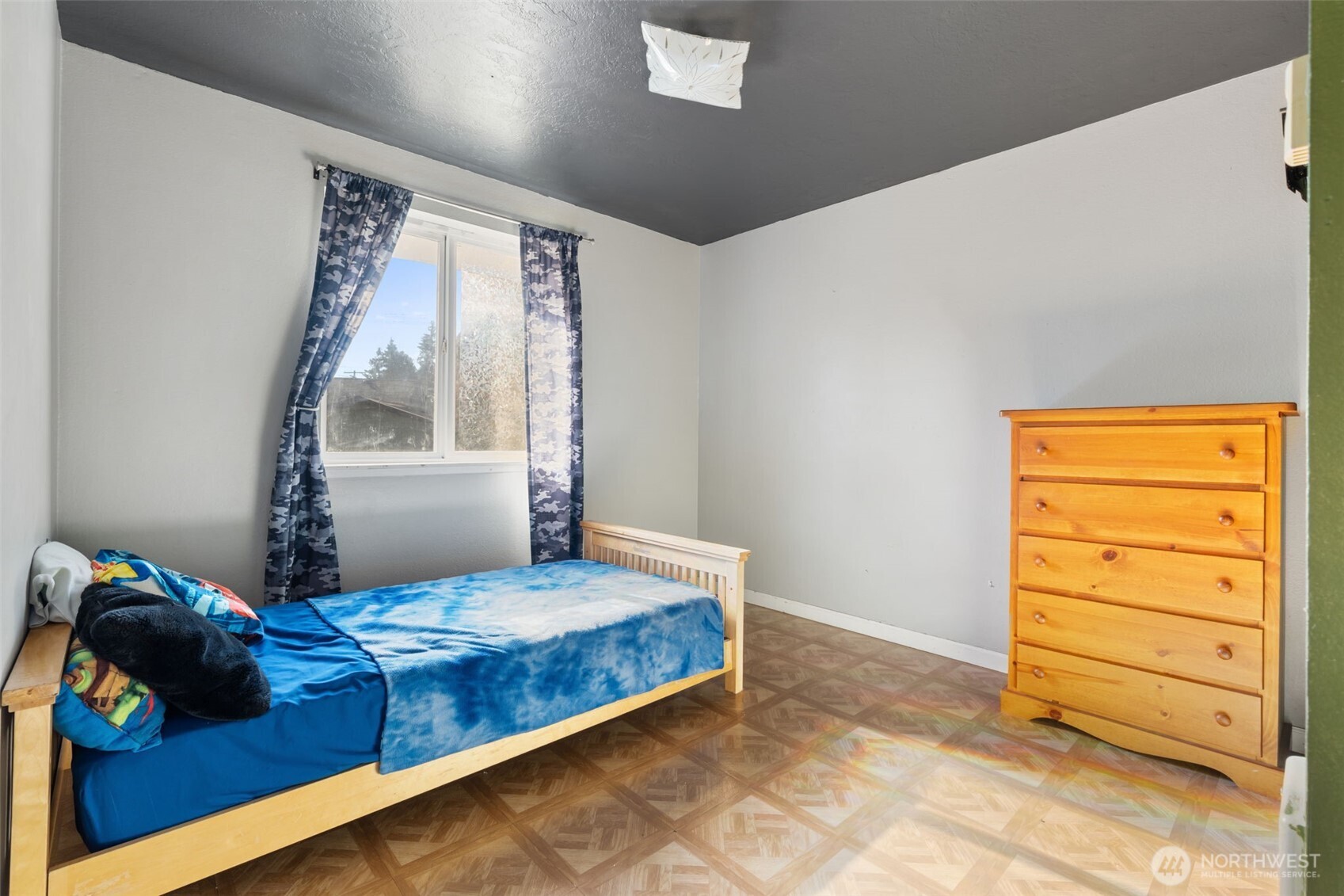 1003 Northwest Dexter Avenue Winlock, WA 98596 - Photo 22 of 39 a bedroom with a bed and a window