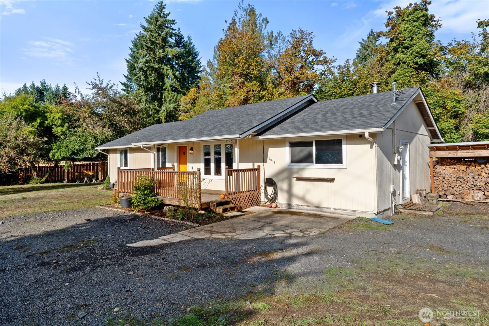 1003 Northwest Dexter Avenue Winlock, WA 98596 - Photo 3 of 39 a white house that has a tree in front of it