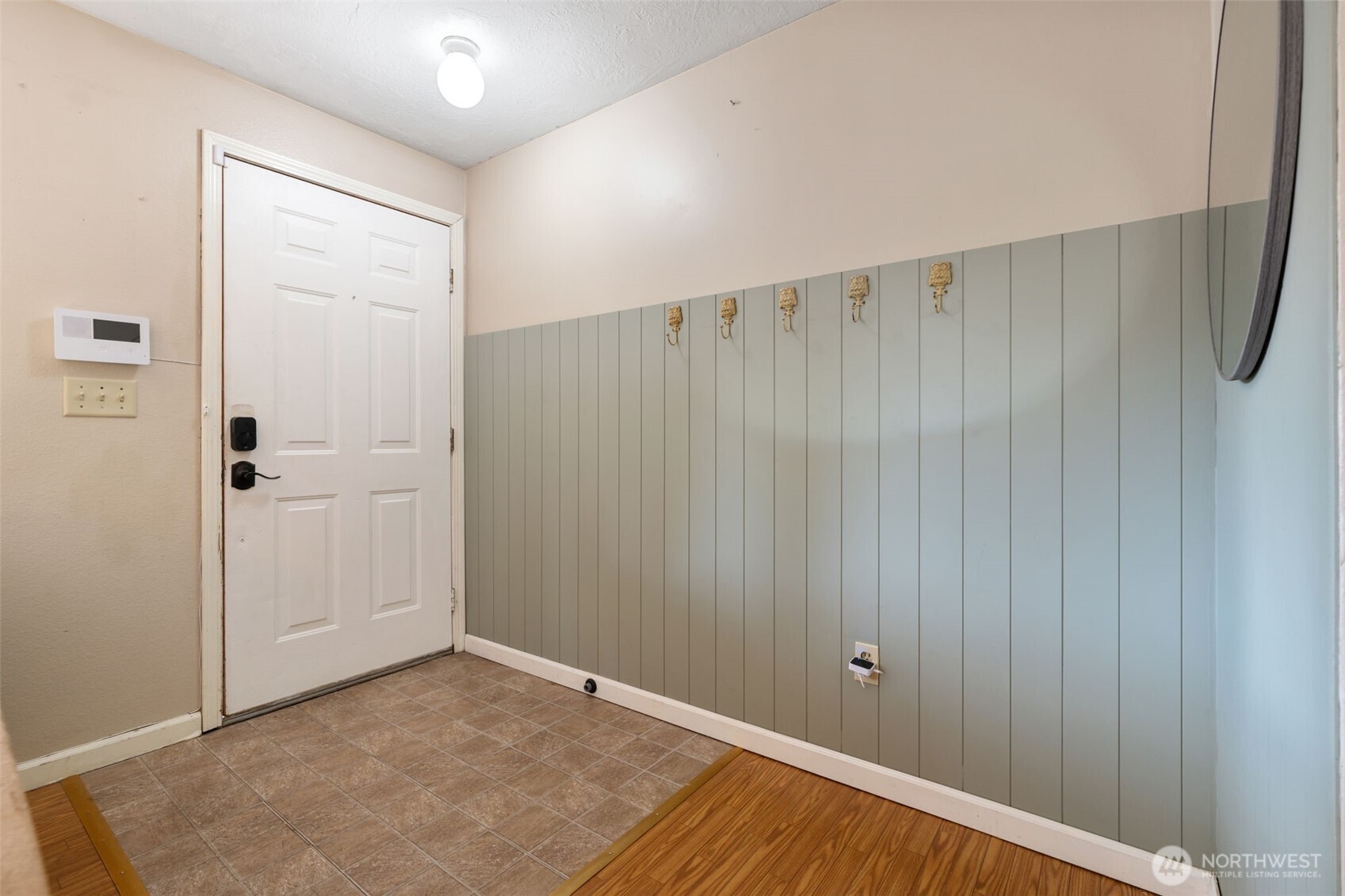 1003 Northwest Dexter Avenue Winlock, WA 98596 - Photo 5 of 39 a view of a room with an empty space and wooden floor