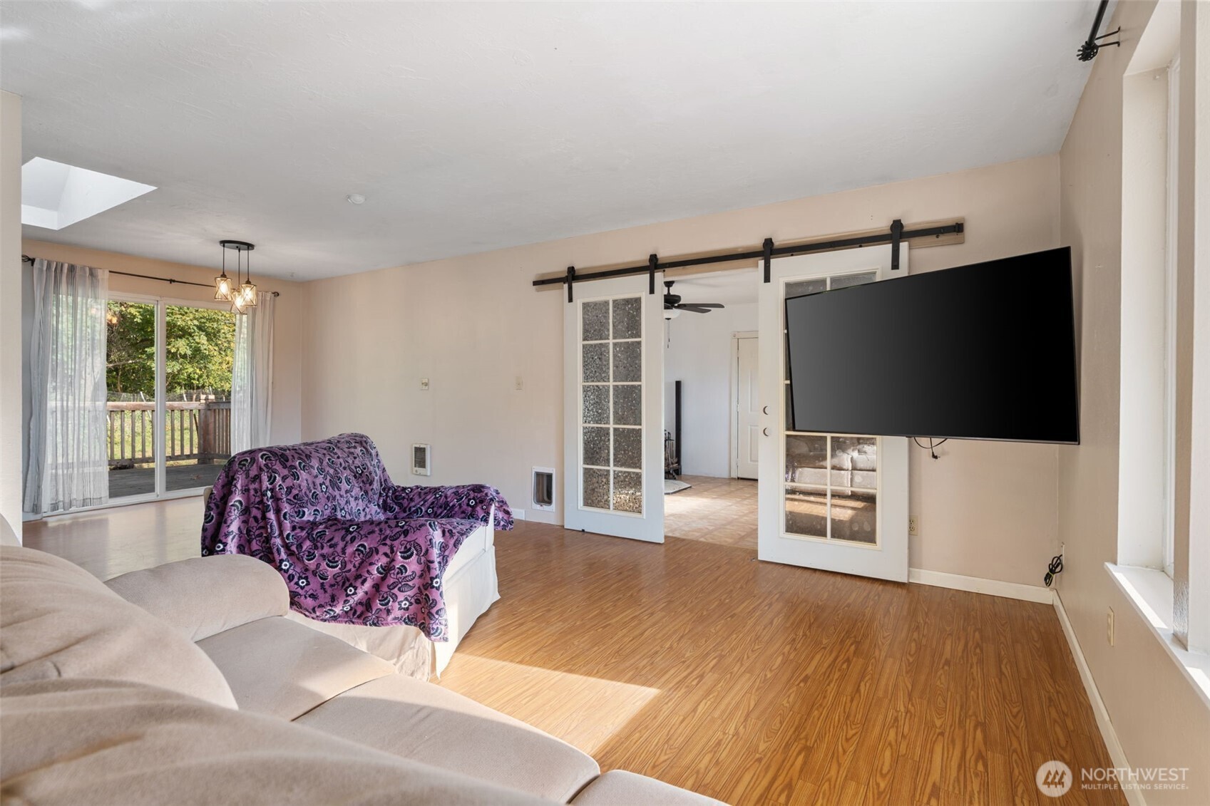1003 Northwest Dexter Avenue Winlock, WA 98596 - Photo 6 of 39 a living room with furniture and a flat screen tv