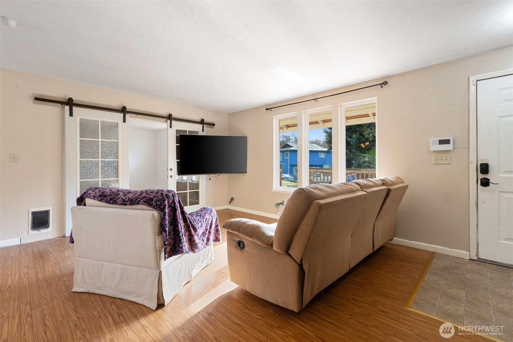 1003 Northwest Dexter Avenue Winlock, WA 98596 - Photo 7 of 39 a living room with furniture and a flat screen tv