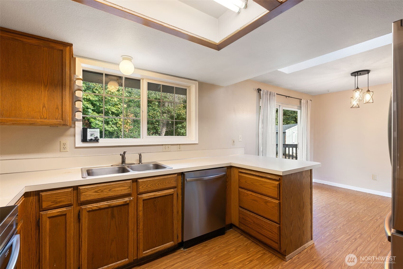 1003 Northwest Dexter Avenue Winlock, WA 98596 - Photo 10 of 39 a kitchen with sink cabinets and window