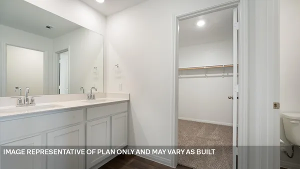 a bathroom with a sink a mirror and a shower