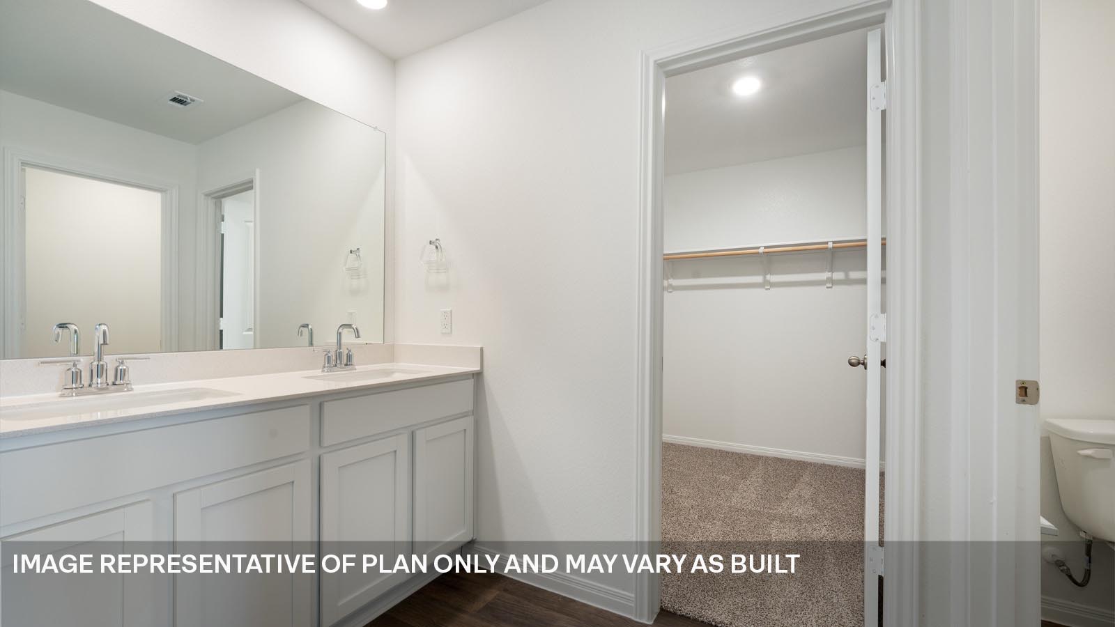 185 Mountain Pea Road Kyle, TX 78640 - Photo 12 of 22 a bathroom with a sink a mirror and a shower