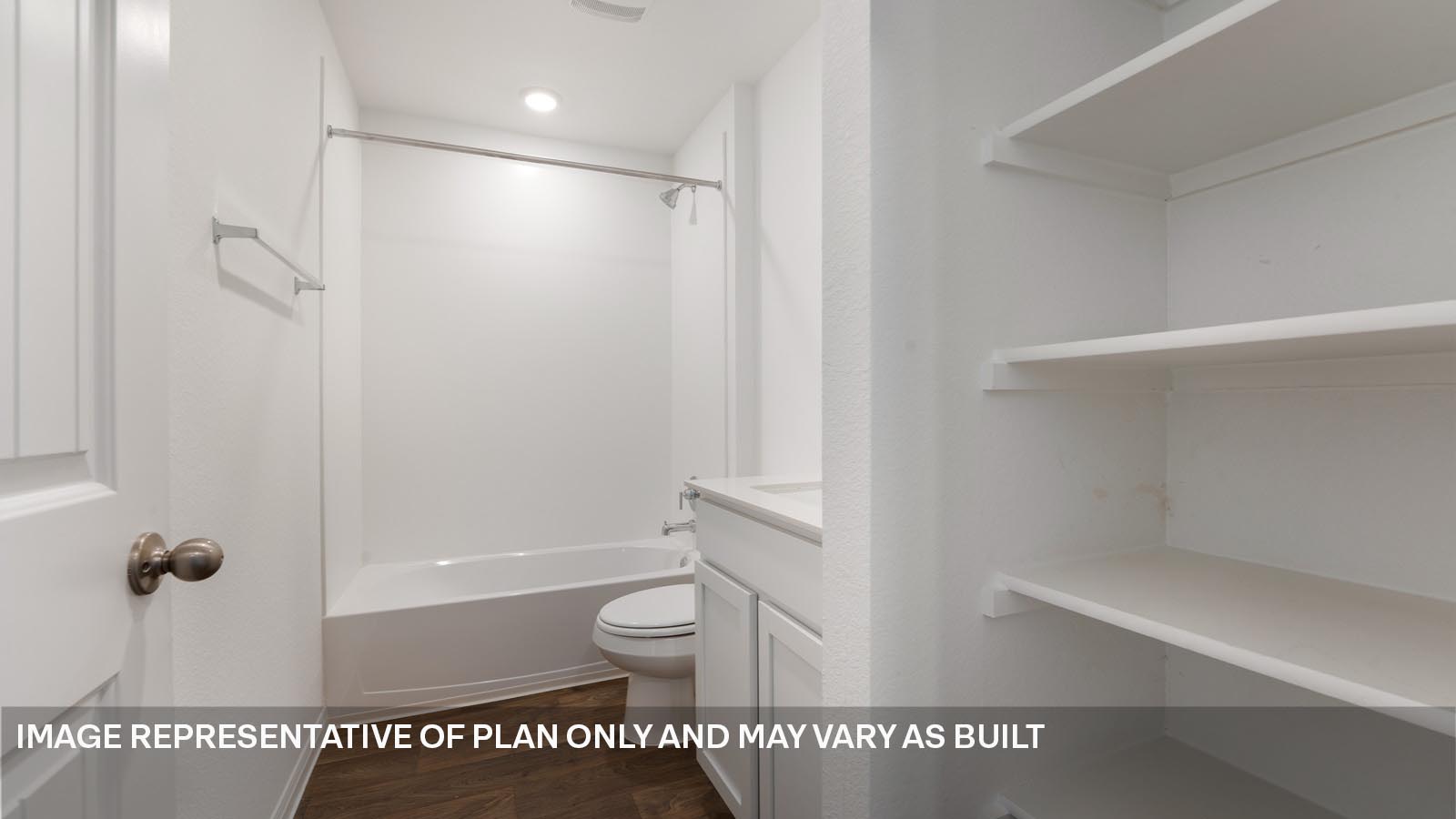 185 Mountain Pea Road Kyle, TX 78640 - Photo 16 of 22 a bathroom with a tub a toilet and a shower