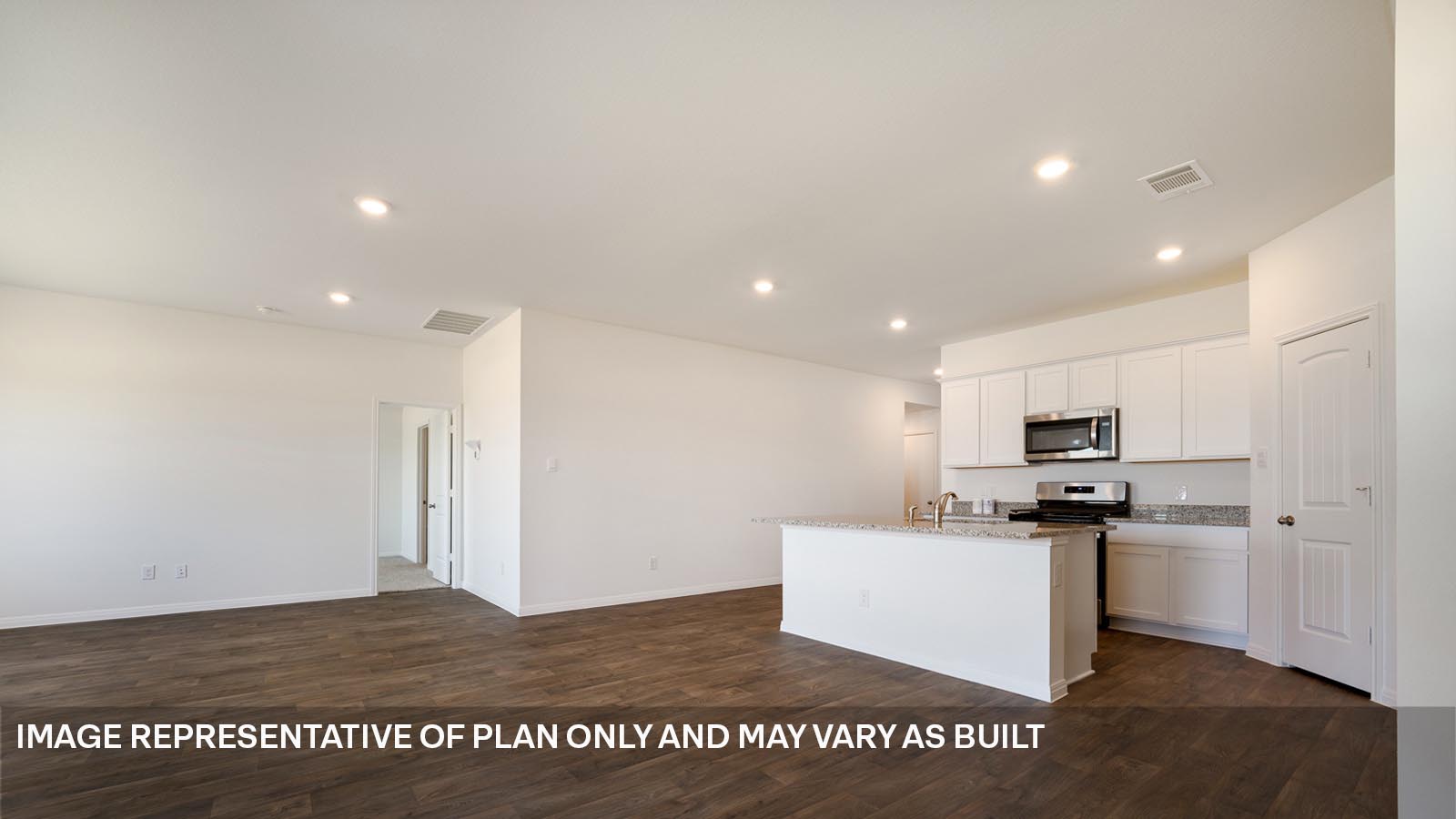 185 Mountain Pea Road Kyle, TX 78640 - Photo 6 of 22 a kitchen with stainless steel appliances kitchen island granite countertop a refrigerator sink and microwave