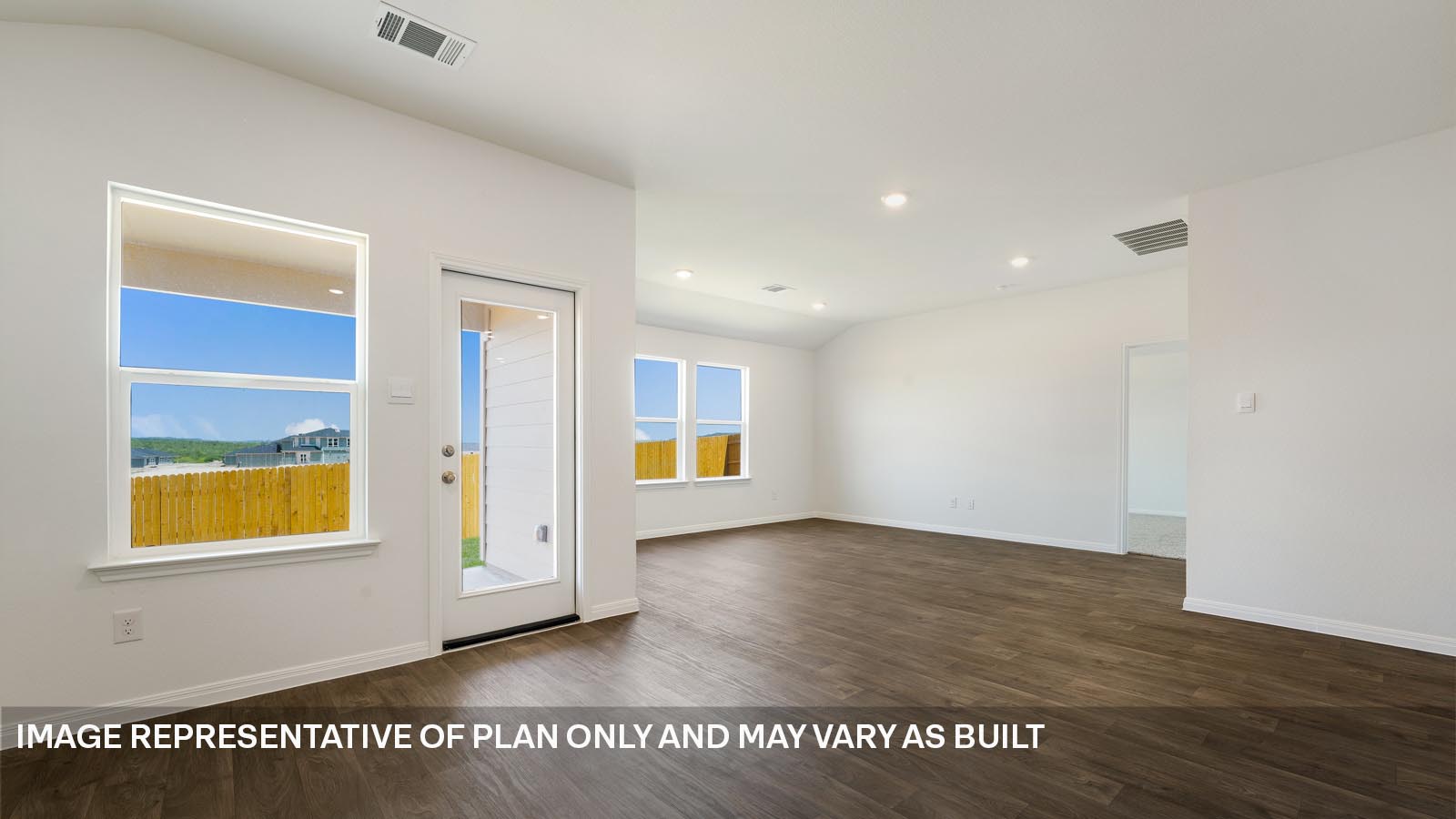 185 Mountain Pea Road Kyle, TX 78640 - Photo 7 of 22 a view of an empty room with window and wooden floor