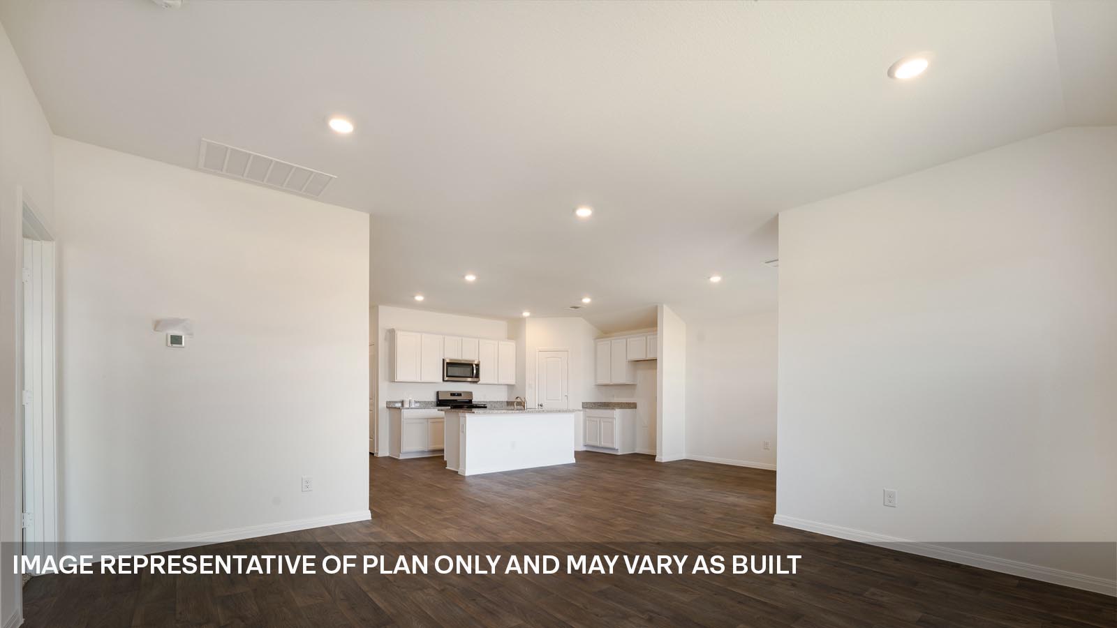 185 Mountain Pea Road Kyle, TX 78640 - Photo 8 of 22 a view of kitchen cabinets and refrigerator