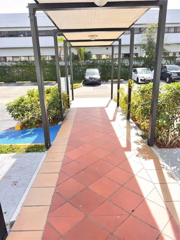 a view of a building with a couple of people