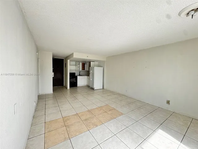 a view of empty room with natural light