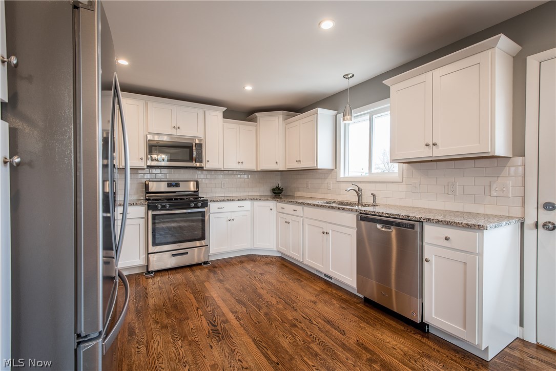 2194 Springfield Center Road Akron, OH 44312 - Photo 11 of 26 Shaker style cabinetry, subway tile backsplash and granite countertops