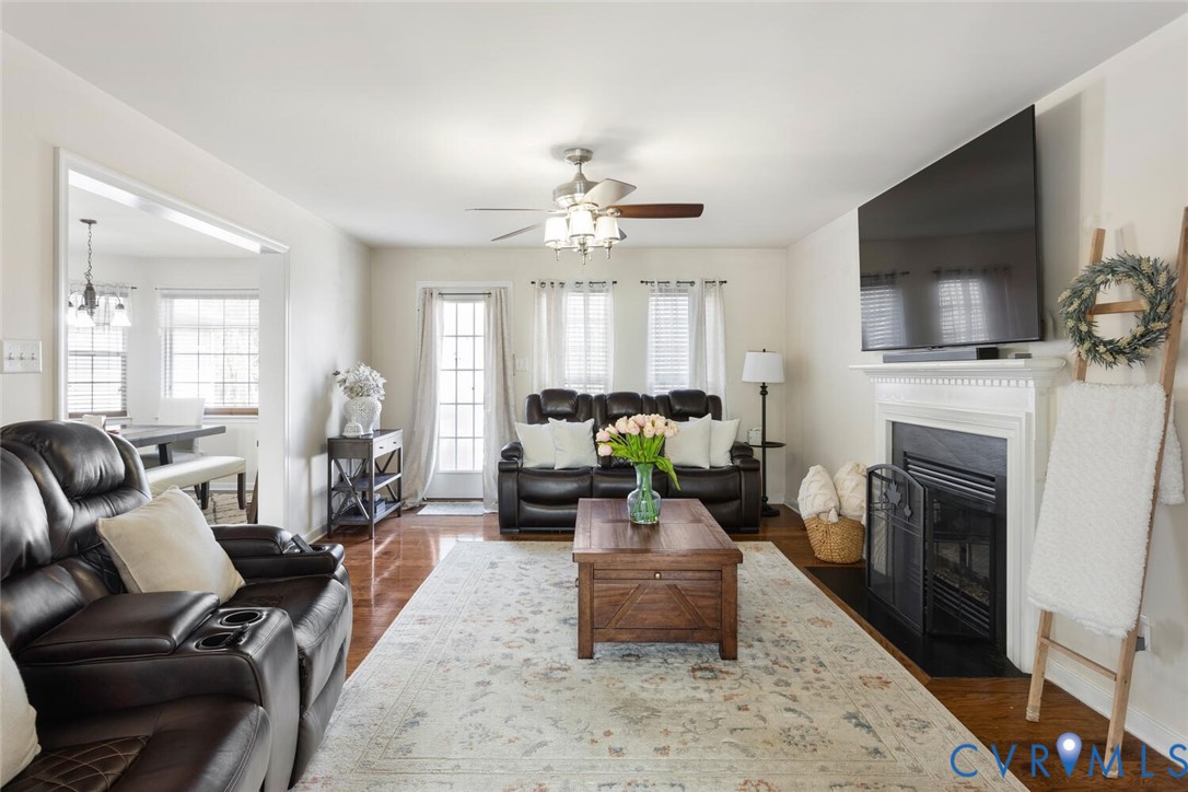 15650 River Road Chesterfield, VA 23838 - Photo 15 of 50 a living room with furniture a fireplace and a flat screen tv