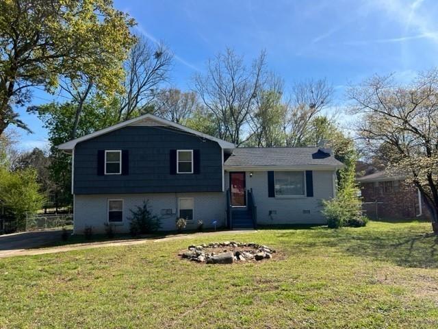 a house that has a tree in front of it