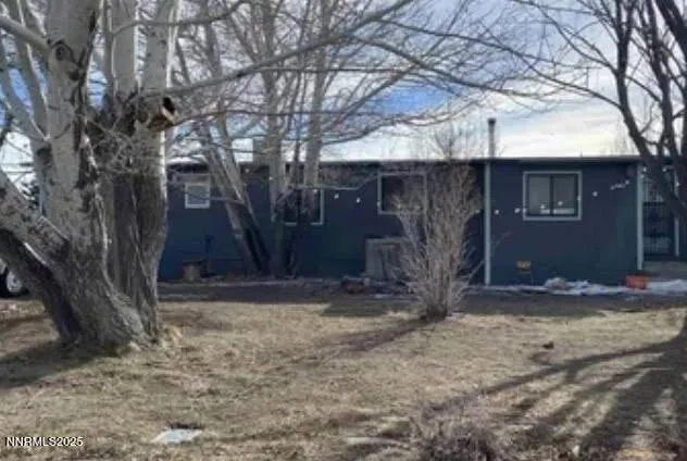 a view of a house with large tree