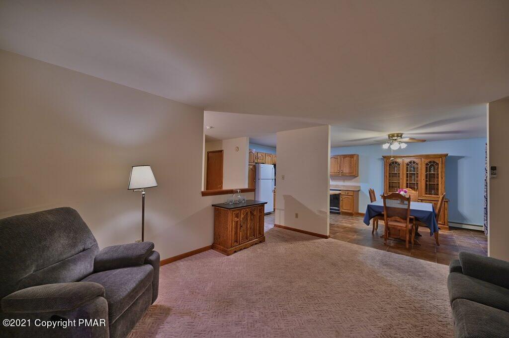 168 Shenkel Road Effort, PA 18330 - Photo 12 of 64 a living room with furniture and a dining room