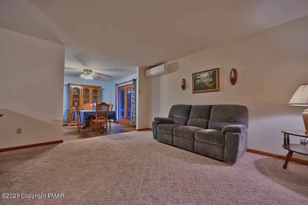168 Shenkel Road Effort, PA 18330 - Photo 14 of 64 a living room with furniture and a window