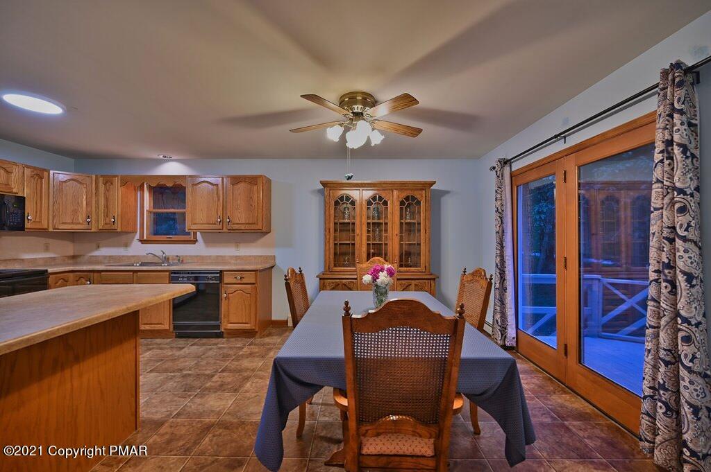 168 Shenkel Road Effort, PA 18330 - Photo 15 of 64 a dining room with furniture a chandelier and window