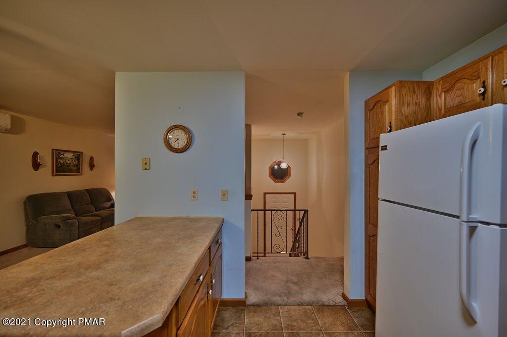 168 Shenkel Road Effort, PA 18330 - Photo 22 of 64 a kitchen with a refrigerator and a sink
