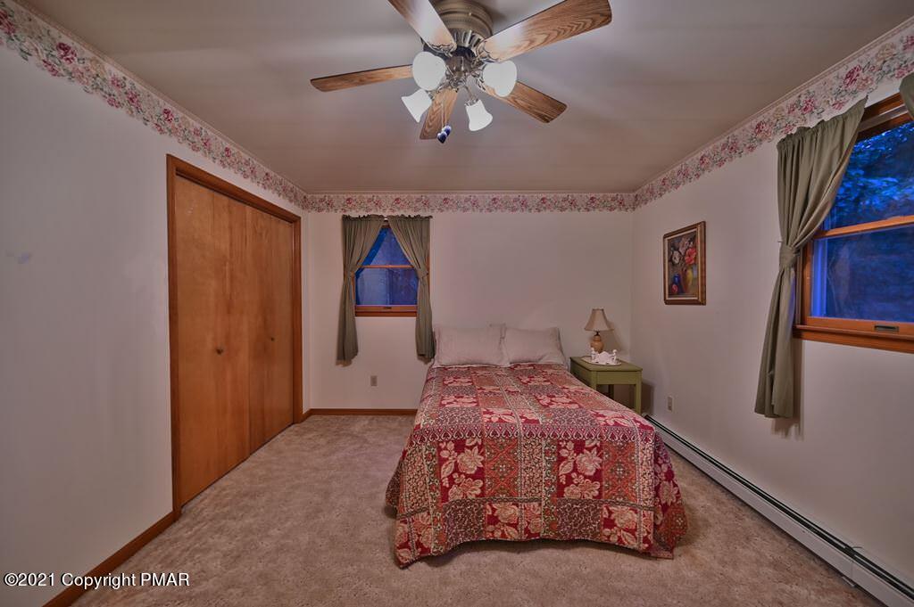 168 Shenkel Road Effort, PA 18330 - Photo 24 of 64 a bedroom with a bed and a window