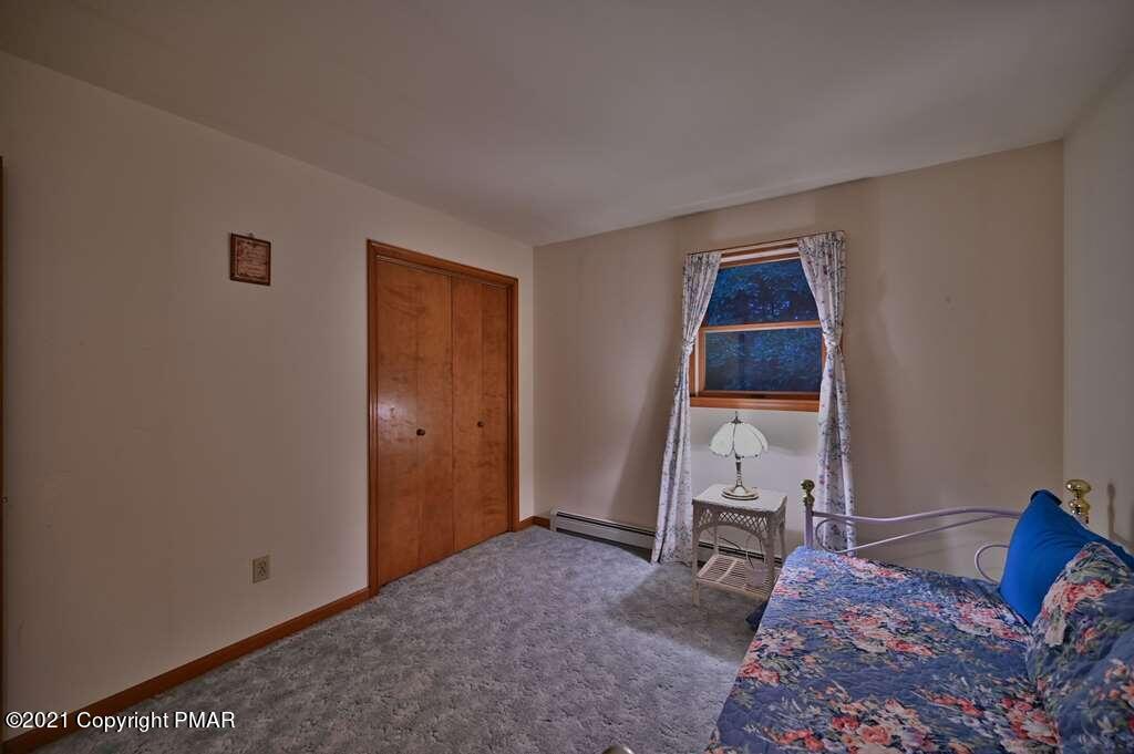 168 Shenkel Road Effort, PA 18330 - Photo 32 of 64 a bed room with a bed and furniture