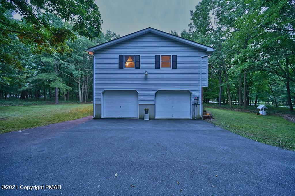 168 Shenkel Road Effort, PA 18330 - Photo 58 of 64 a front view of a house with garden