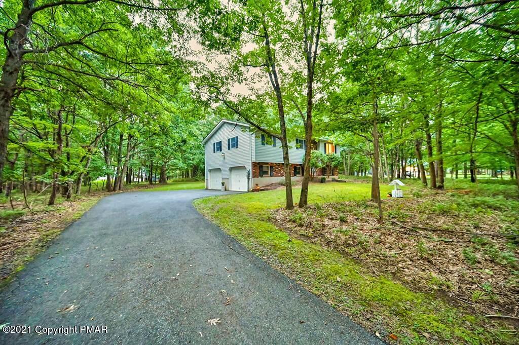 168 Shenkel Road Effort, PA 18330 - Photo 7 of 64 a view of a house with a yard and tree s